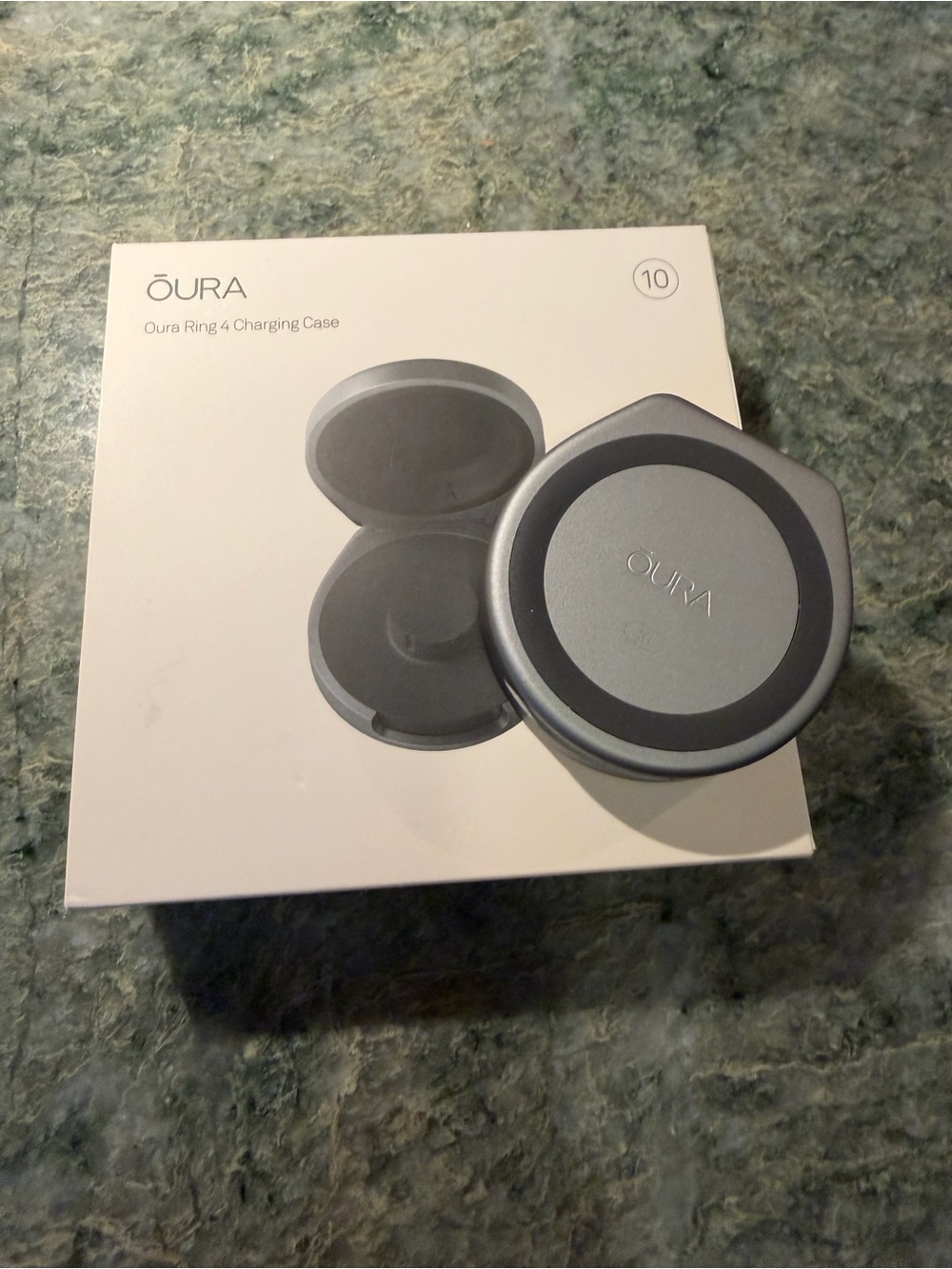 Oura Ring 4 portable charging case.